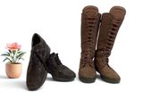 two pairs of boots that are next to a potted plant