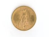 an image of a gold coin on a white surface