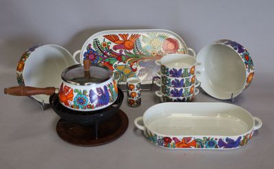 many different types of dishes and bowls on the table
