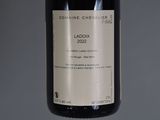 a bottle of wine that is sitting on a table