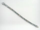 bracelet made of silver beads with a silver clasp on a white background
