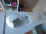 a white computer mouse sitting on top of a table