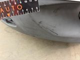 a close up of a car ' s front bumper with a ruler on it