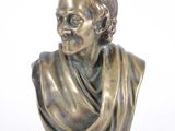 bronze bust of a man with a scarf on his head