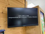 a television mounted on the wall in a room