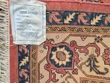 a rug that has a tag on it and a tag on it