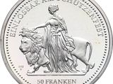 an image of a close up of a coin with a woman on a lion