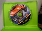 a green box with a game on it and a cd in it