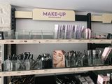 many makeup products on the shelves in the store