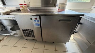 a stainless steel counter top in a commercial kitchen