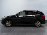 the bmw x1 is parked in a large room
