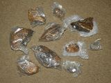 many bags of food that are sitting on the floor