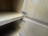 a wooden cupboard with two shelves in it