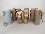 several different types of gas masks are lined up in a row