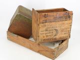 a small wooden box with a lid that has a label on it