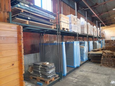 a room filled with lots of boxes and pallets