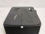 an image of a black projector sitting on top of a white table