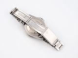 an image of a close up of a wrist watch on a white surface