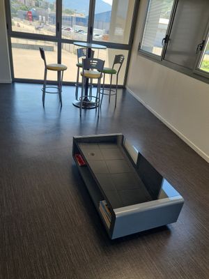 hardwood flooring in an office with a tread tread in the middle of the room