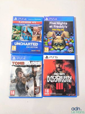 four playstation game covers on a white table with a white background