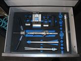 a box with tools inside of it on a table