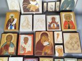 a lot of religious icons on display on a table