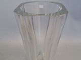 a glass vase that is sitting on a table