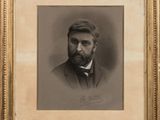 a black and white photo of a man with a beard