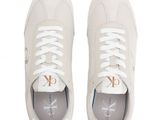 a pair of white sneakers on a white background