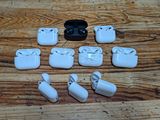 a lot of airpods that are sitting on a table