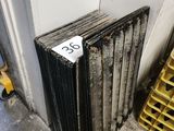 a radiator sitting next to a stack of crates