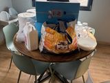 a table that has some food on it in front of a window