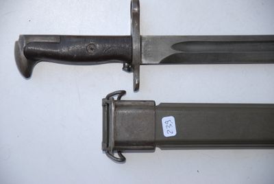 two knives that are laying next to each other on a table