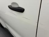 a white car with a black handle on the door