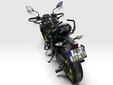 a motorcycle that is parked on a white surface