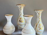 three vases that are sitting on a table