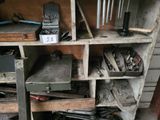 a shelf that has many tools on it