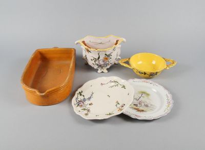 several different types of dishes and bowls on a gray surface