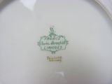 a white plate with a green design on it
