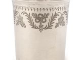 an image of a silver cup with a floral design on it