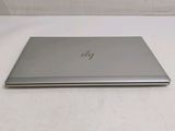 a laptop that is sitting on a white table
