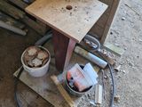 a picture of a wooden table with tools on it