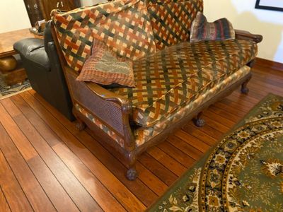 an image of a living room with a couch and a rug