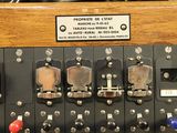a close up of a control panel with multiple switches and knobs