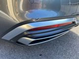 a close up of the rear end of a silver car