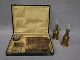 a box with silverware and a pair of lamps
