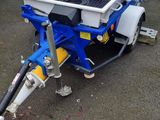 an image of a small trailer with a water tank attached to it