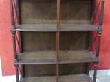 a wooden shelf with a mirror on top of it