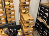 many boxes that are stacked on top of each other in a room