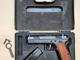a gun in a case with a pair of scissors